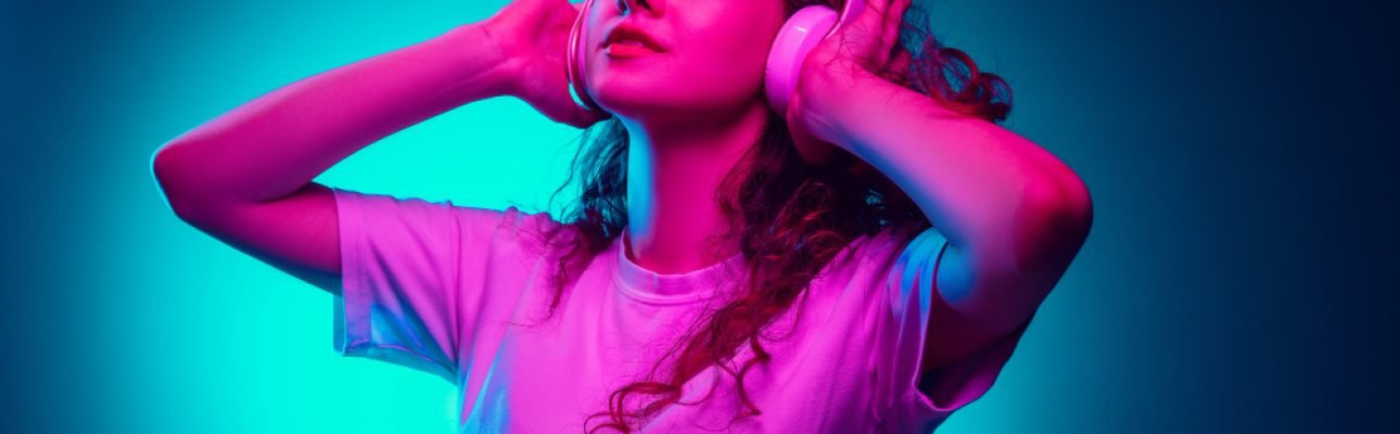 caucasian-woman-s-portrait-isolated-blue-background-multicolored-neon-light